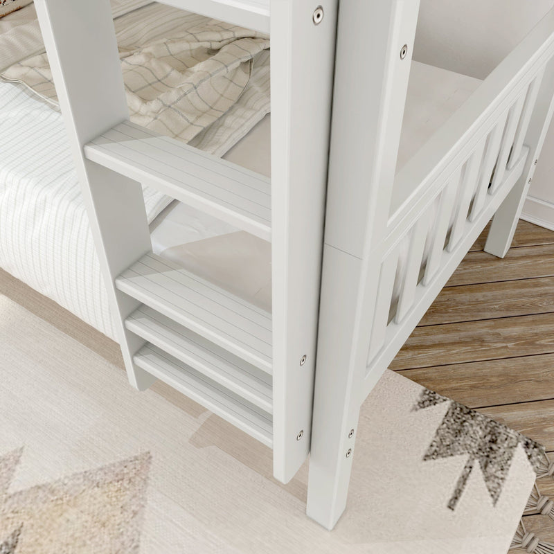 White wooden bunk bed ladder close-up with beige plaid blanket, striped bedding and hardwood floor