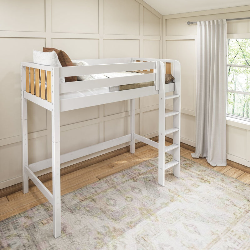 White wooden loft bed with ladder and wood slats in a bright neutral kids bedroom with paneled walls, white curtains, hardwood floor and patterned rug