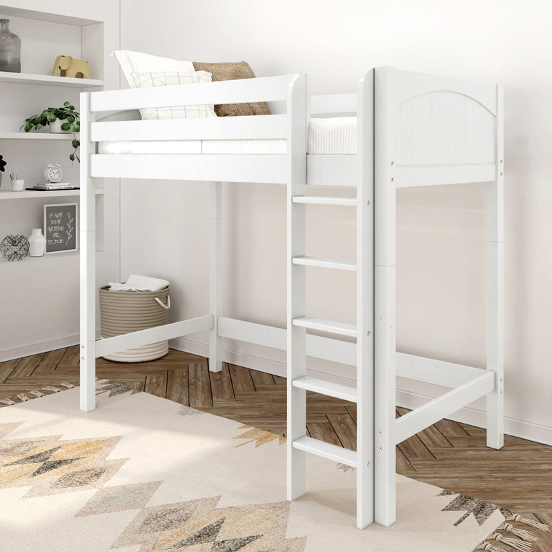 White wooden loft bed with ladder in a modern neutral kids' bedroom, featuring pillows, woven storage basket, built-in shelves and patterned rug