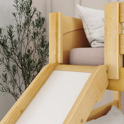 Wooden children's bed with slide and cushion in modern room decor.