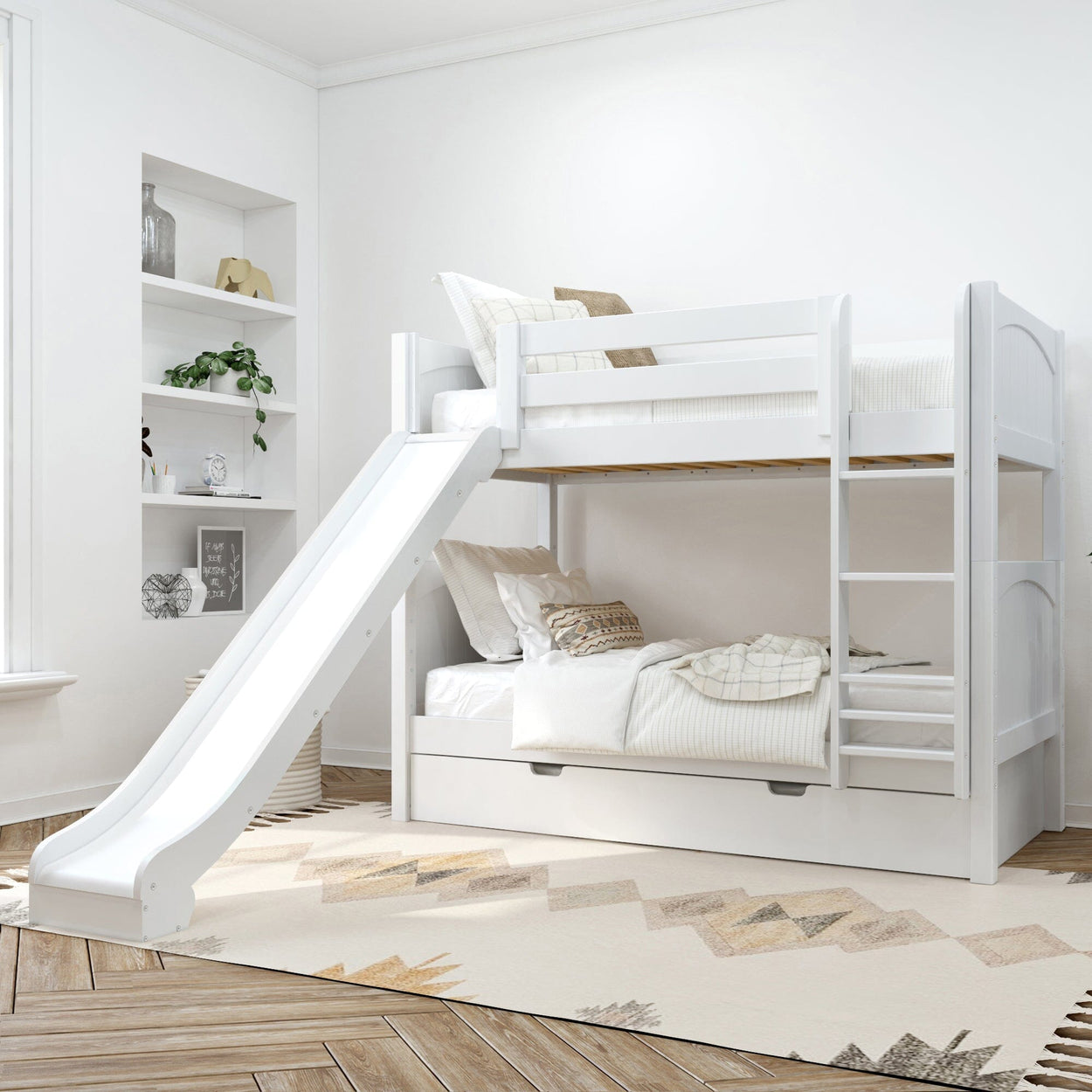 White wooden bunk bed with slide and ladder in a bright modern kids' bedroom, neutral bedding, under-bed storage drawer, hardwood floor and built-in wall shelves