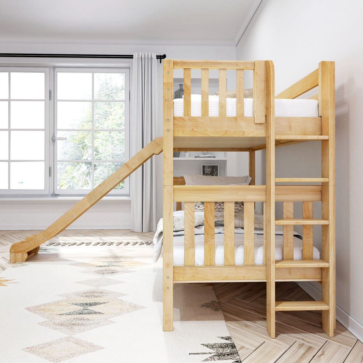 Wooden bunk bed with slide in bright, modern kids' room featuring natural light from large window.