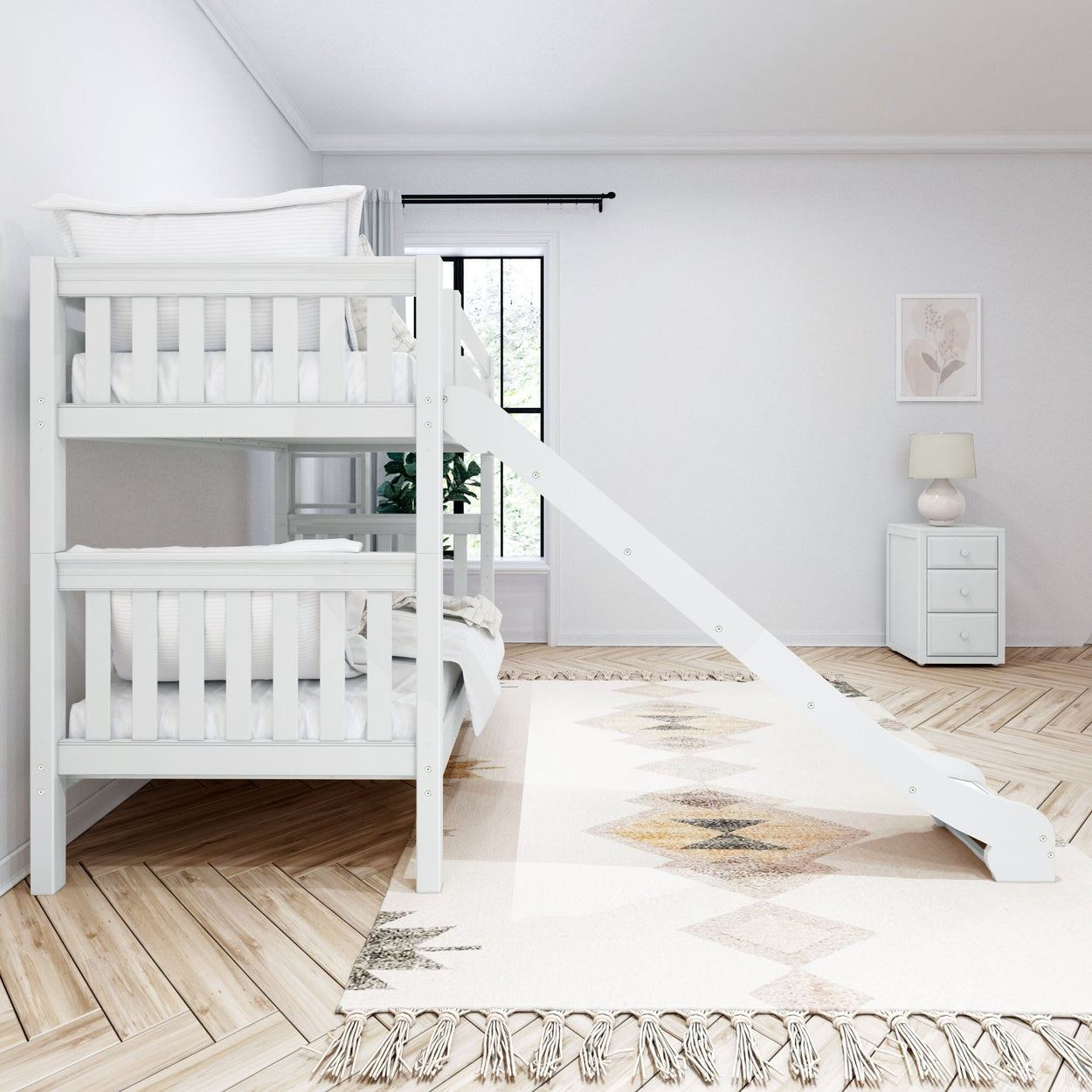 White bunk bed with slide beside a modern nightstand in a minimalist children's bedroom.