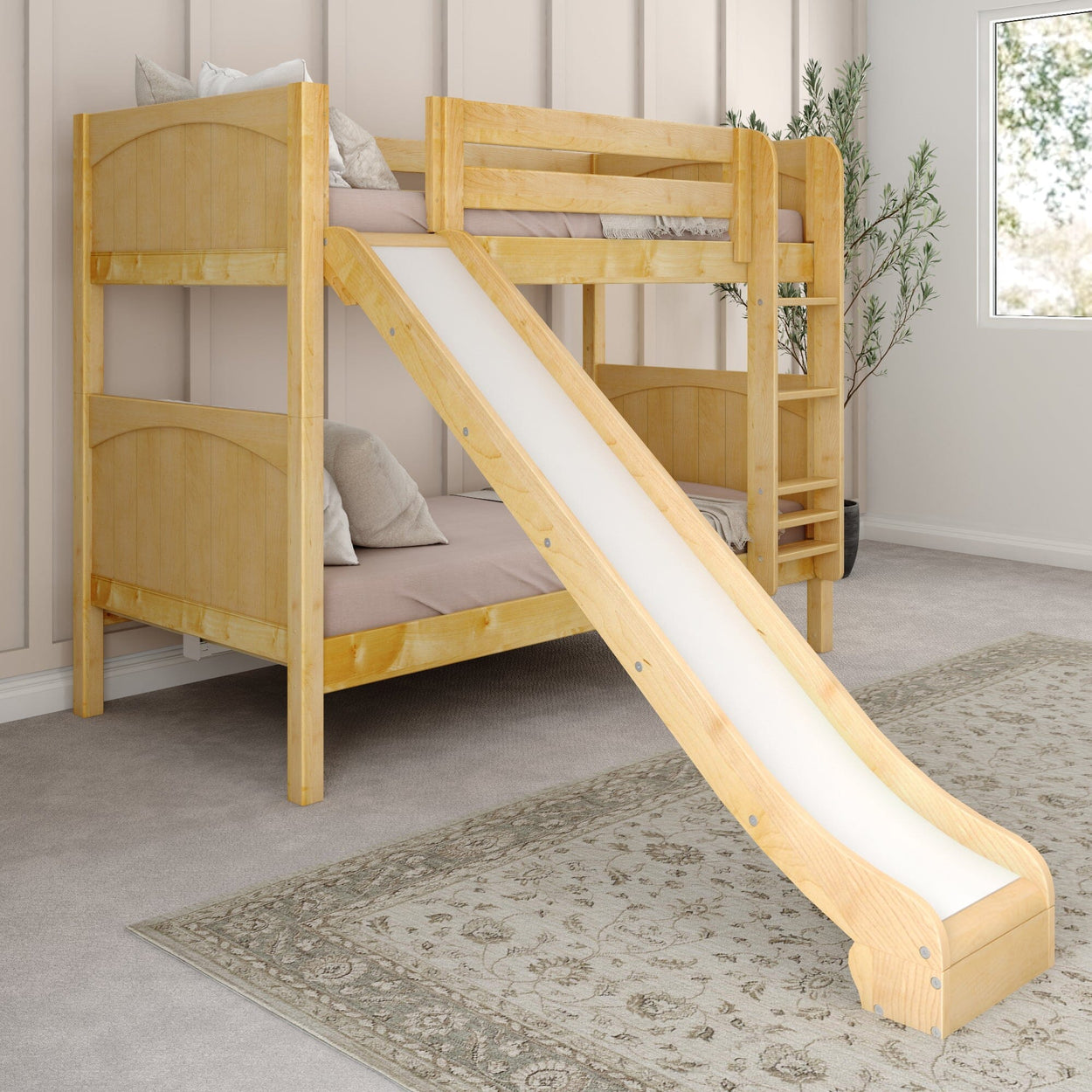 Wooden bunk bed with slide in a stylish bedroom setting, featuring beige walls, gray carpet, and decorative plants.