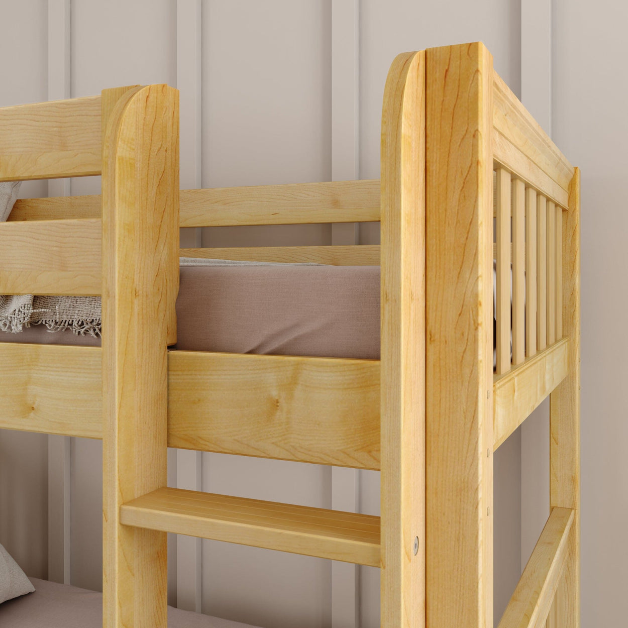 Wooden bunk bed with beige linens in a cozy bedroom.