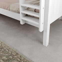 White wooden bunk bed ladder near textured carpet and patterned rug in a cozy bedroom setting.