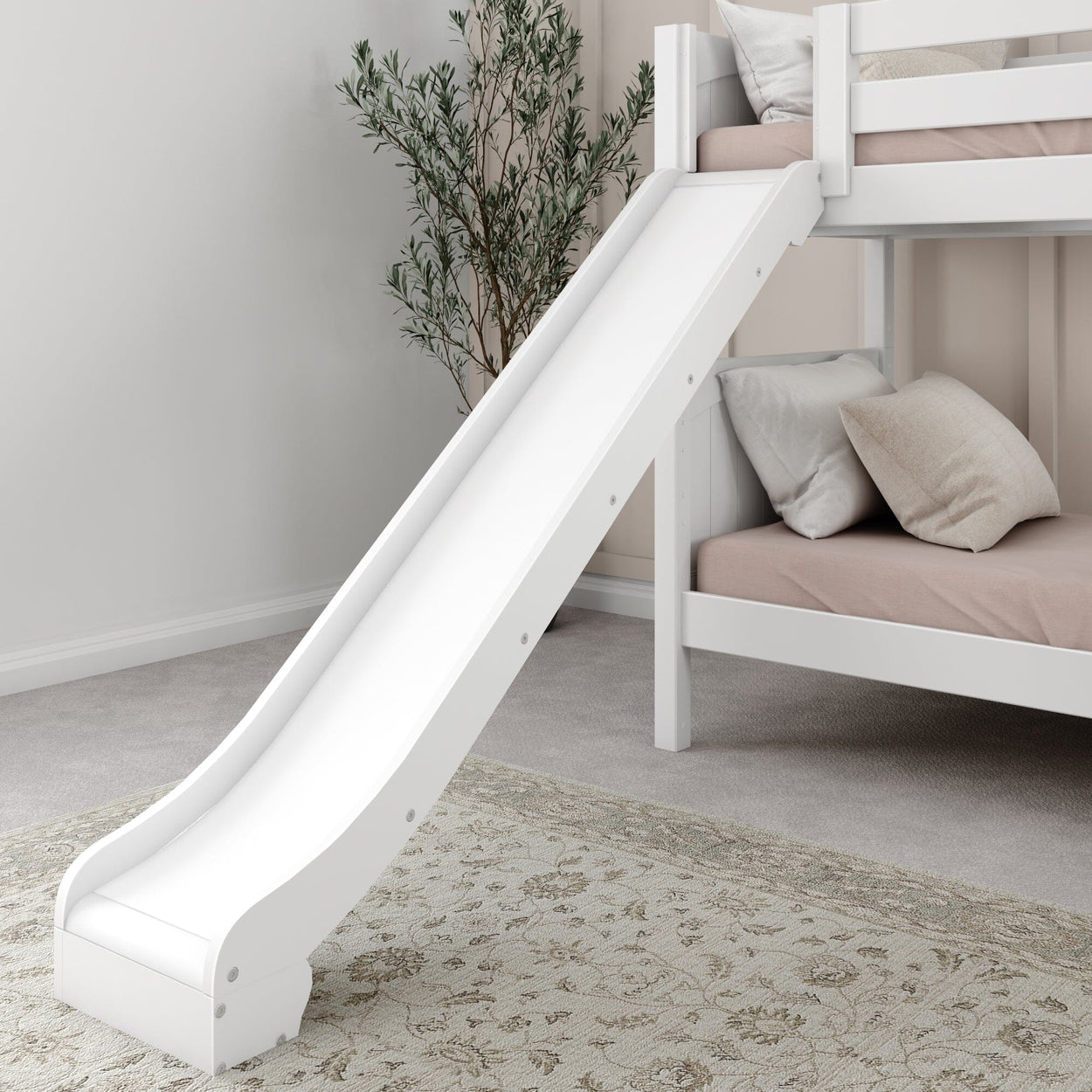 White wooden bunk bed with slide and pillows in a cozy bedroom setting.