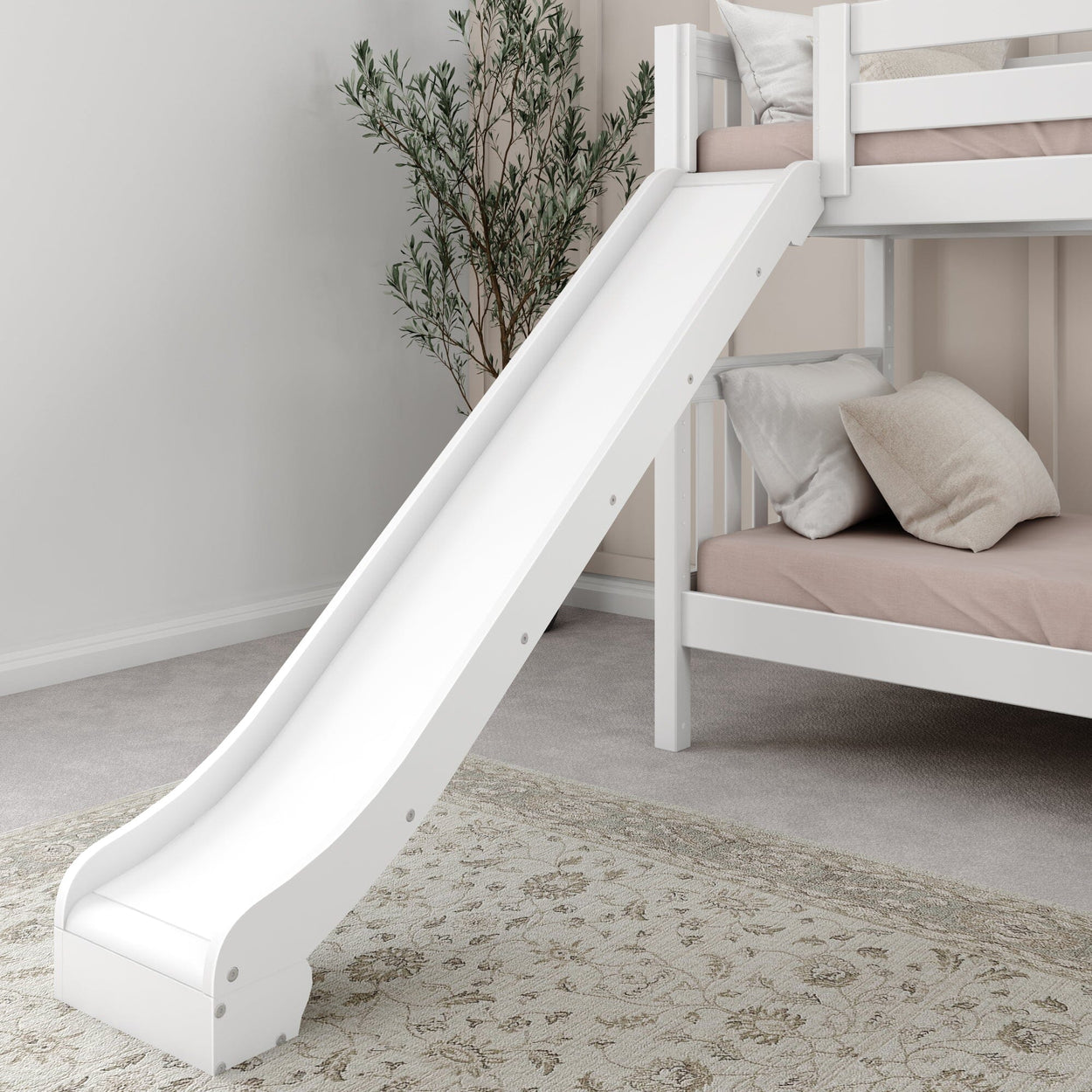 White bunk bed with slide in children's room, featuring pink bedding and decorative cushions.