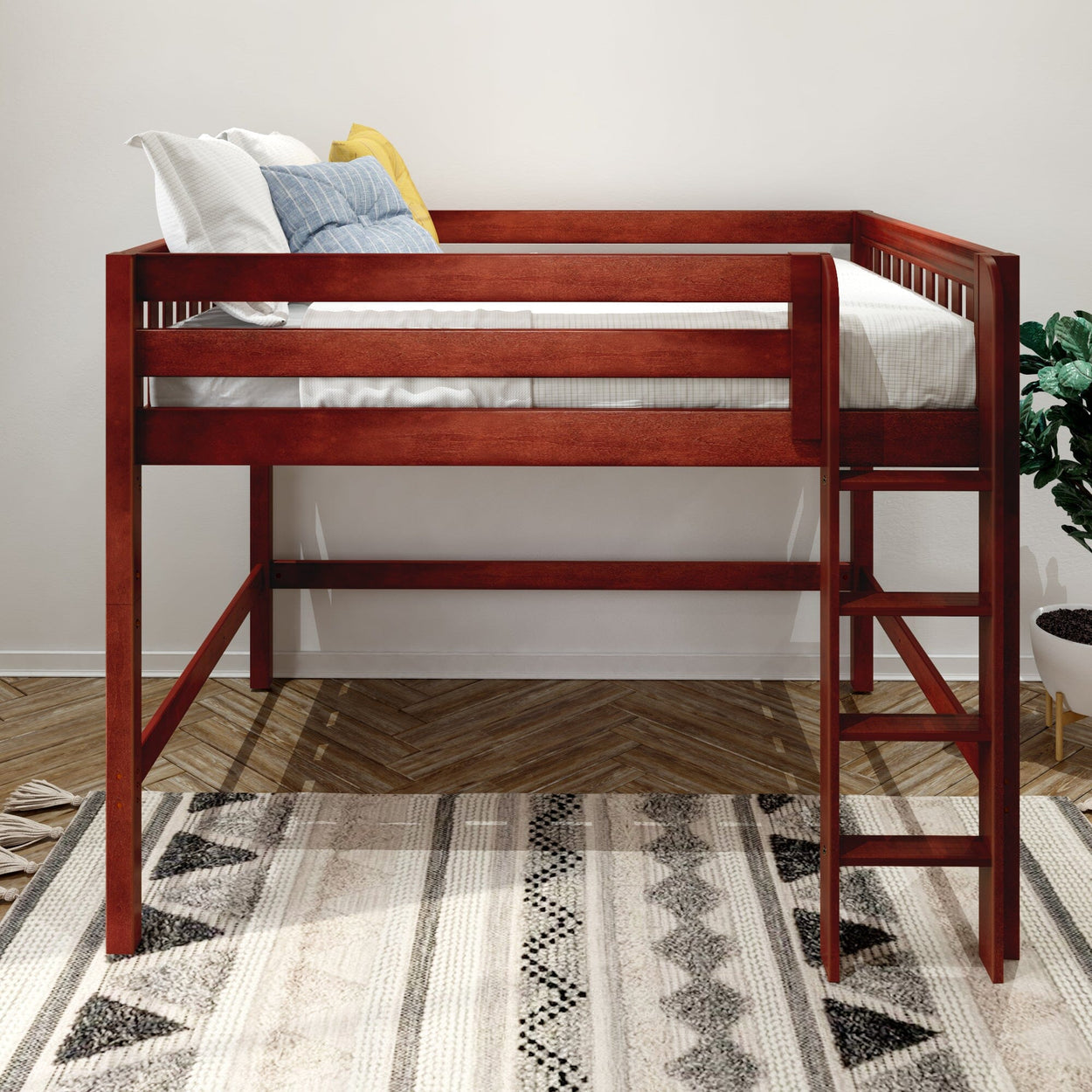 Solid wood twin loft bed with ladder in warm cherry finish, space-saving kids' bedroom furniture with mattress, pillows and patterned rug