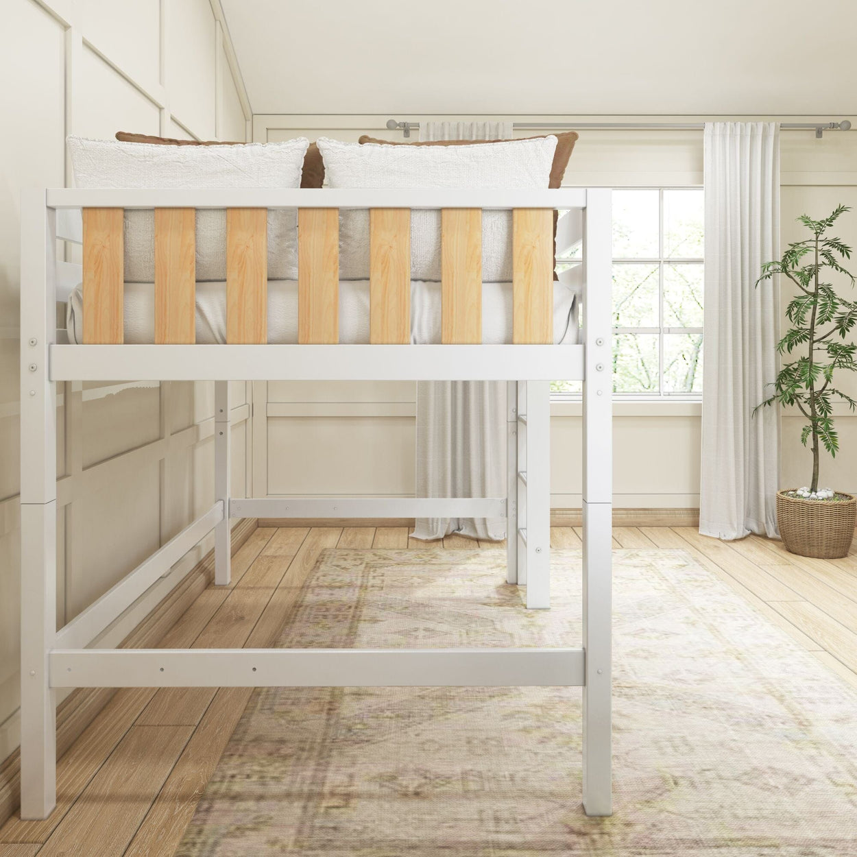White twin loft bed with natural wood slat guardrail in bright neutral bedroom with textured pillows, window and potted plant