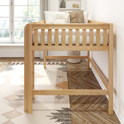 Elevated natural wood toddler loft bed with slatted guardrail, white bedding and decorative pillows in bright modern nursery with herringbone hardwood floor and geometric rug