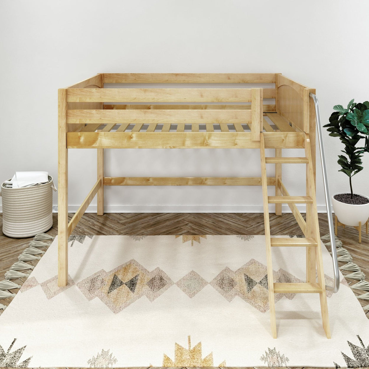 Space-saving natural wood twin loft bed with ladder in minimalist kids' bedroom, slatted platform, geometric area rug, woven storage basket and potted plant on herringbone wood floor