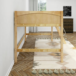 Natural pine twin loft bed frame in minimalist bedroom with herringbone hardwood floor, tasseled boho rug, window and dark dresser