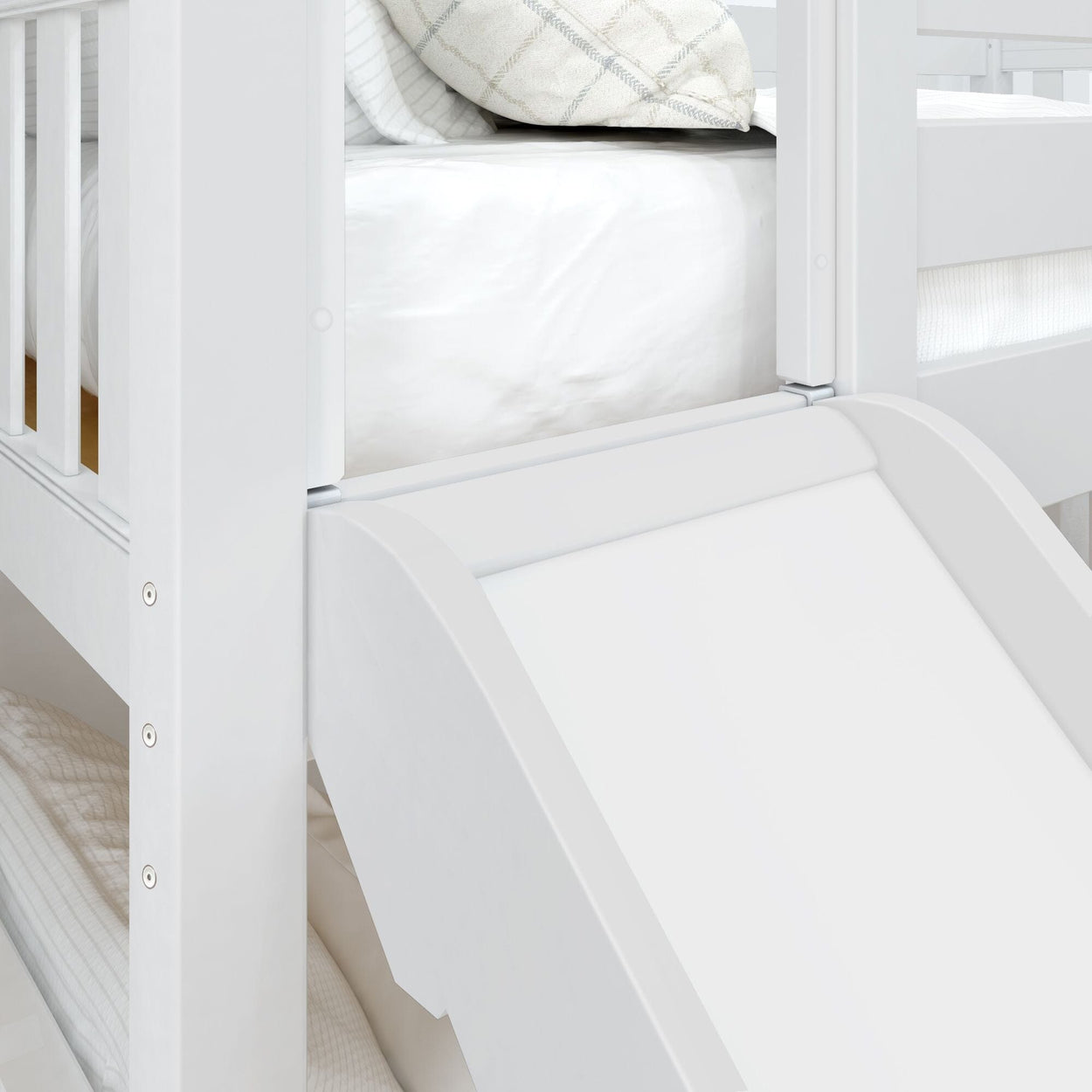 White wooden bunk bed with slide, featuring comfortable bedding and pillows in a modern bedroom setting.