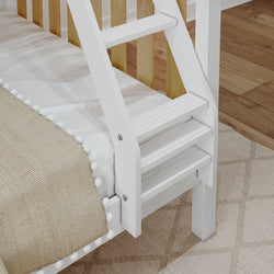 White wooden bunk bed ladder attached to a cozy bed with a beige blanket and decorative pom-poms, placed on a patterned rug in a hardwood-floored bedroom.