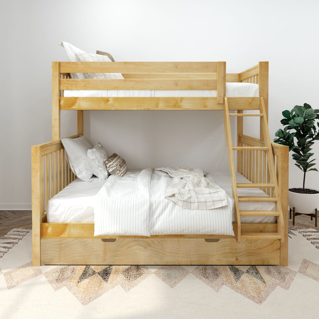 Natural wood full-over-twin bunk bed with ladder and under-bed storage drawer, white linens and pillows in a modern kids' bedroom