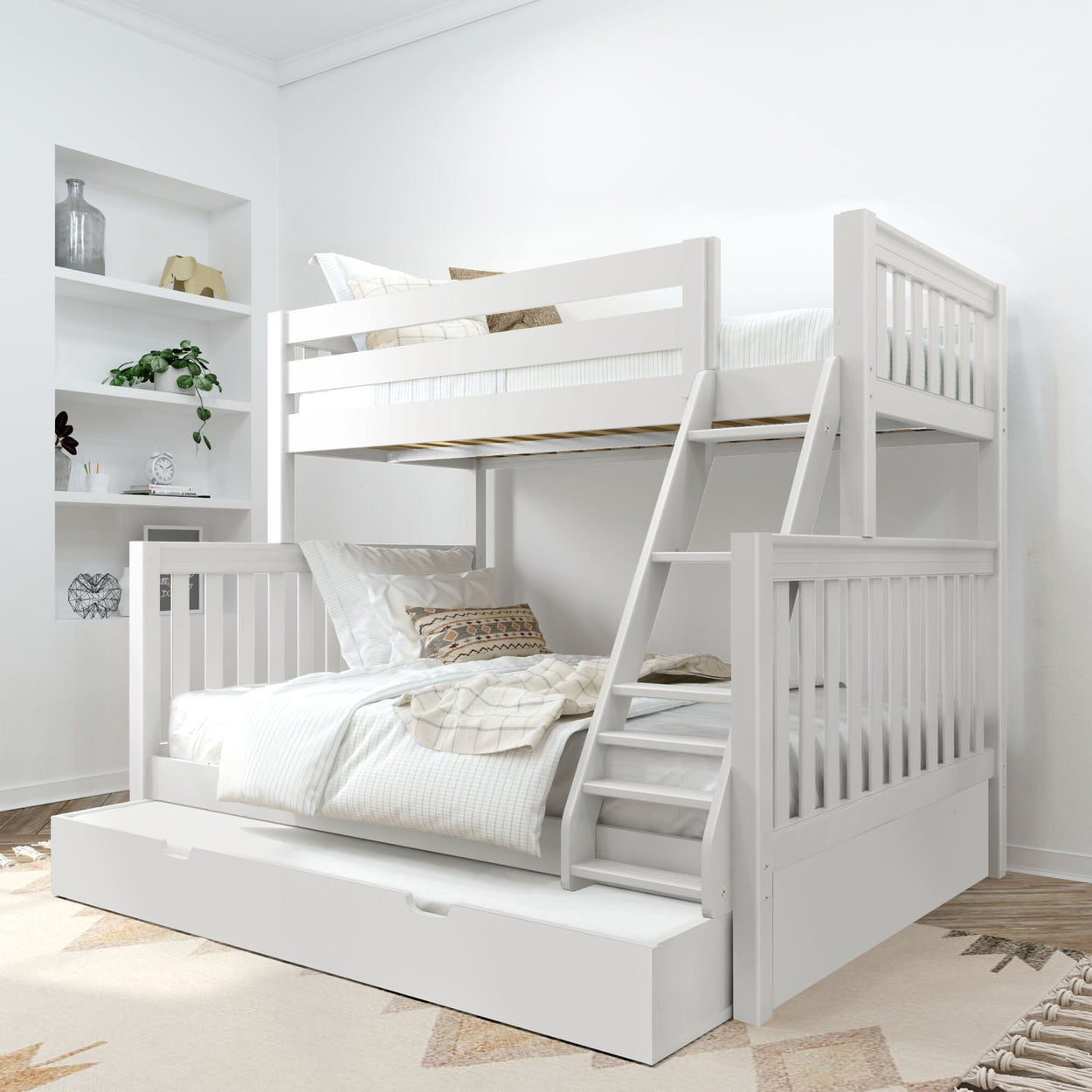 White wooden bunk bed with built-in ladder and pull-out trundle drawer in a modern neutral kids bedroom with white bedding, decorative pillows, and wall shelving