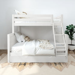 White wooden twin-over-full bunk bed with ladder and storage trundle, neutral striped bedding, decorative pillows and potted plant in a modern space-saving kids' bedroom
