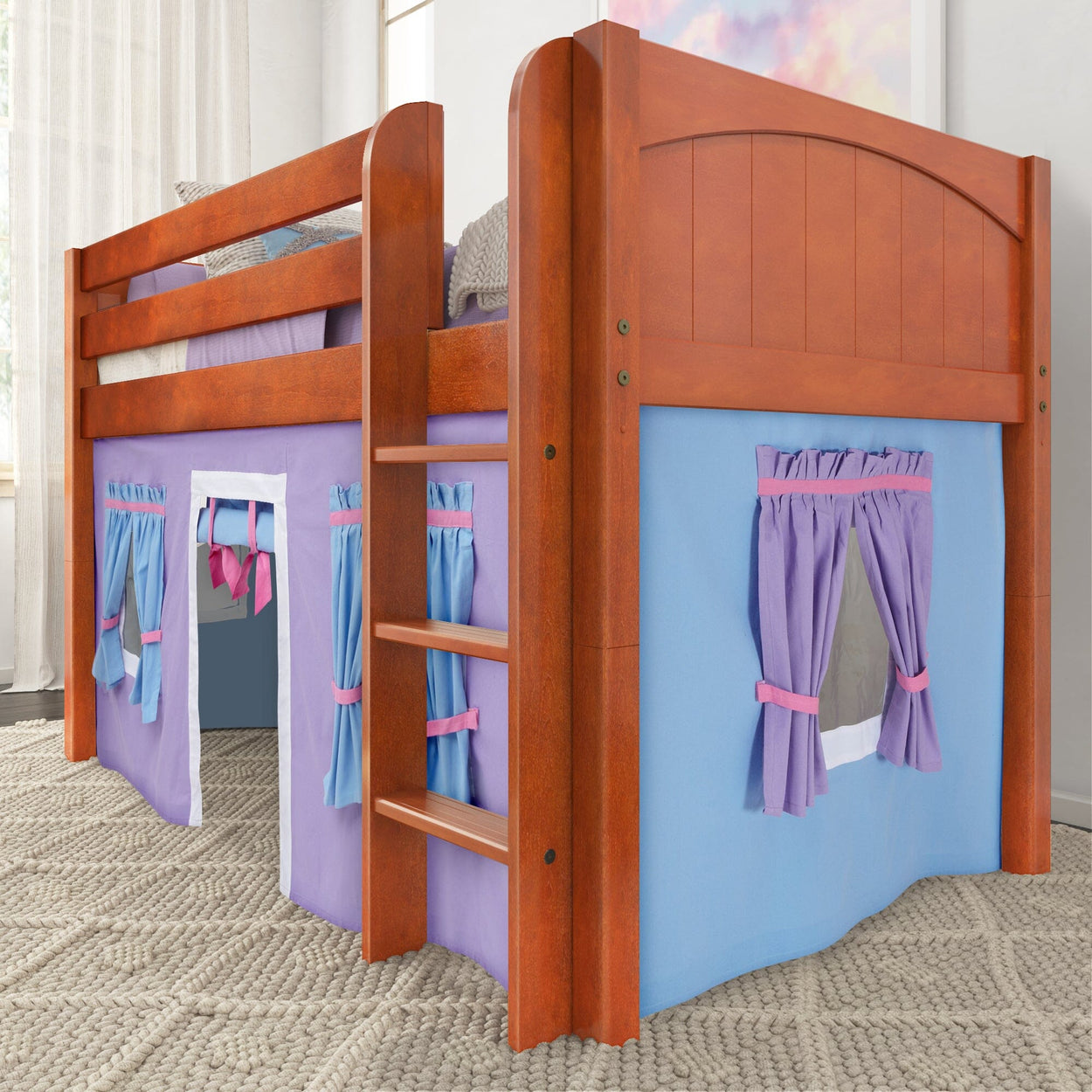 Kids wooden loft bed with colorful playhouse curtains and ladder.