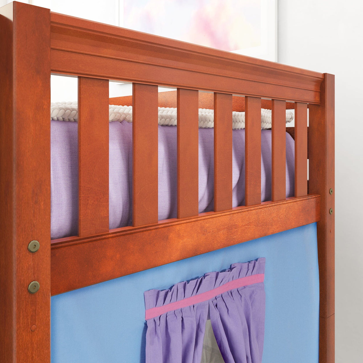 Wooden loft bed frame with purple and blue curtains in a child's bedroom.