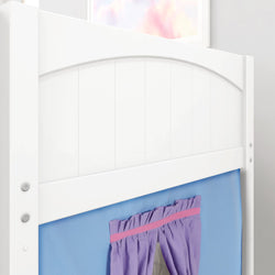 White wooden bed frame with a blue and purple curtain in a children's bedroom.