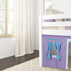 Loft bed with purple and blue curtain in a bright child’s room with hardwood floors and large windows.