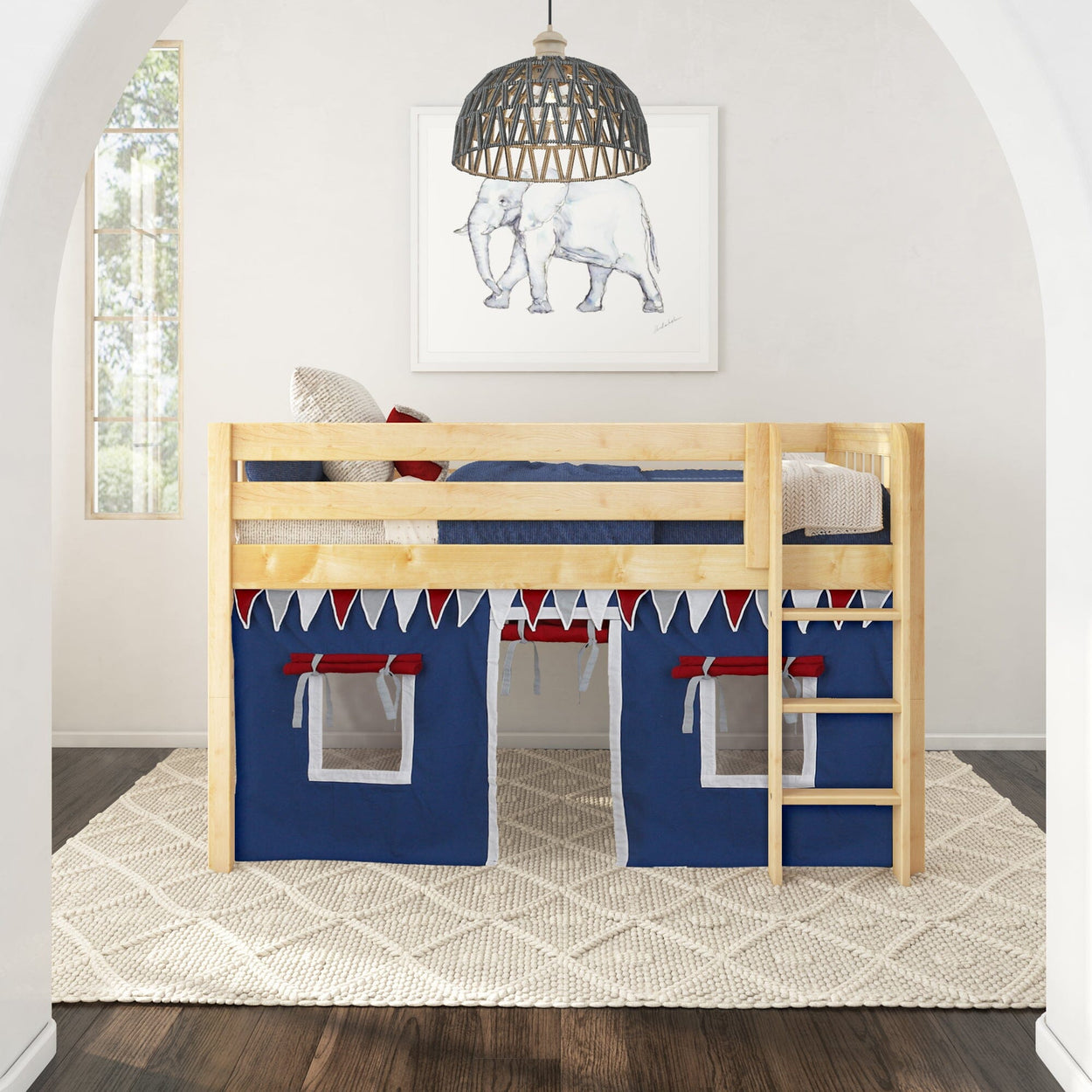 Stylish wooden bunk bed with blue tent curtains and ladder in bright kids' room.