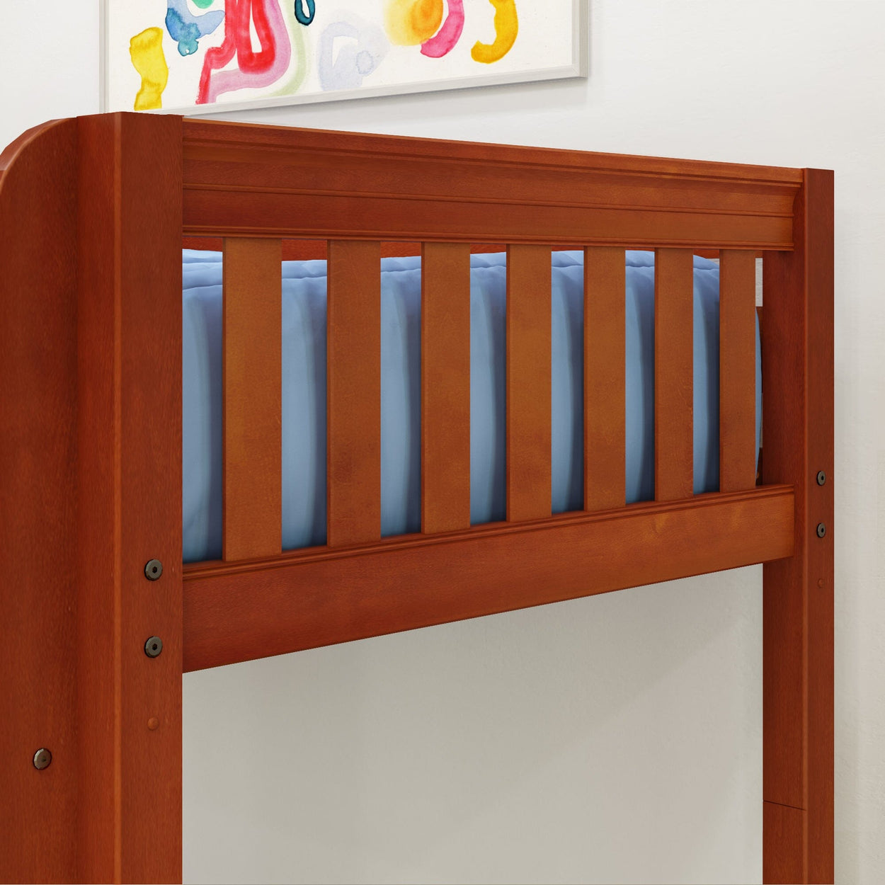 Wooden bunk bed side with light blue mattress and colorful wall art above, ideal for modern kids' room decor.