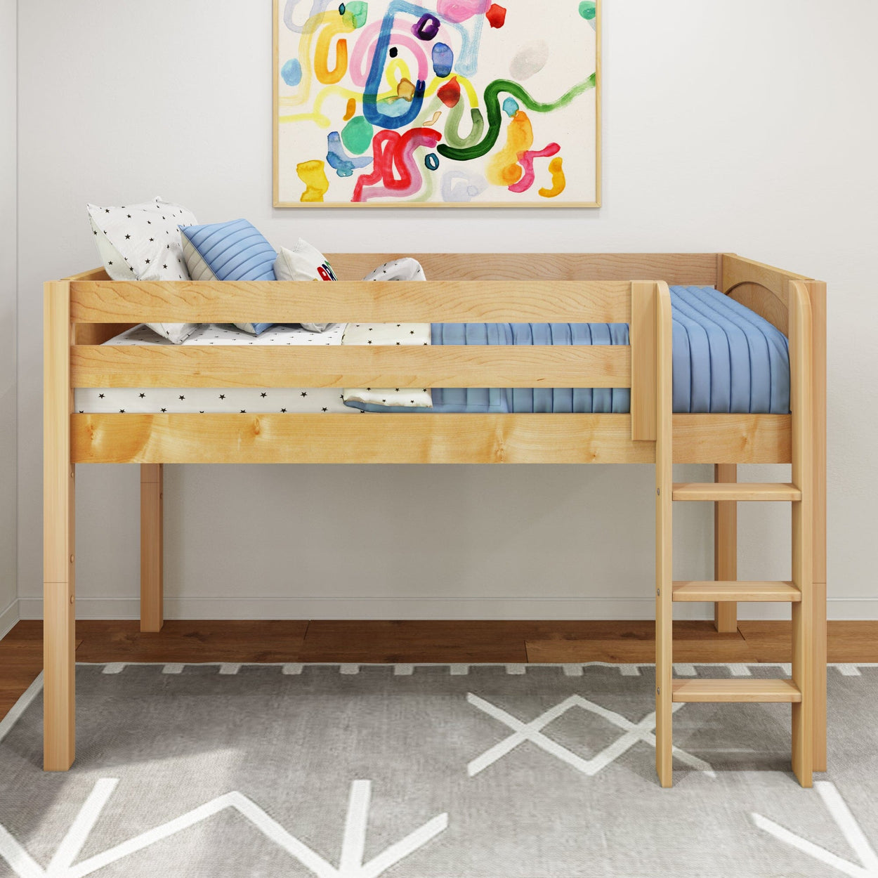 Wooden loft bed with ladder and blue bedding in a modern children's room with colorful wall art.