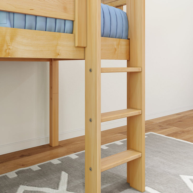 Close-up of natural pine wooden bunk bed ladder and frame with blue mattress, hardwood floor and gray patterned rug in a children's loft bedroom