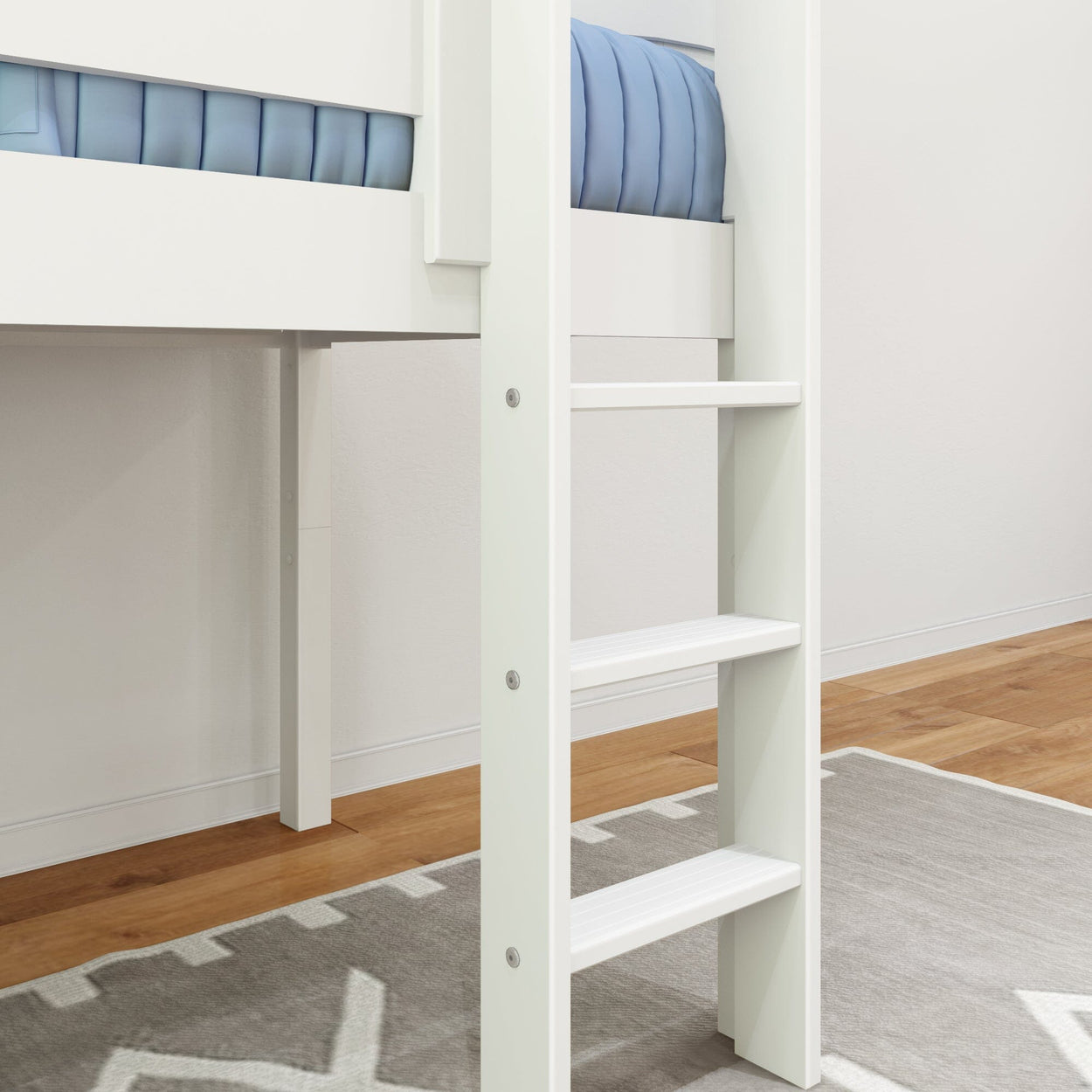 White wooden ladder leading to an elevated bunk bed with blue bedding on a geometric-patterned rug.