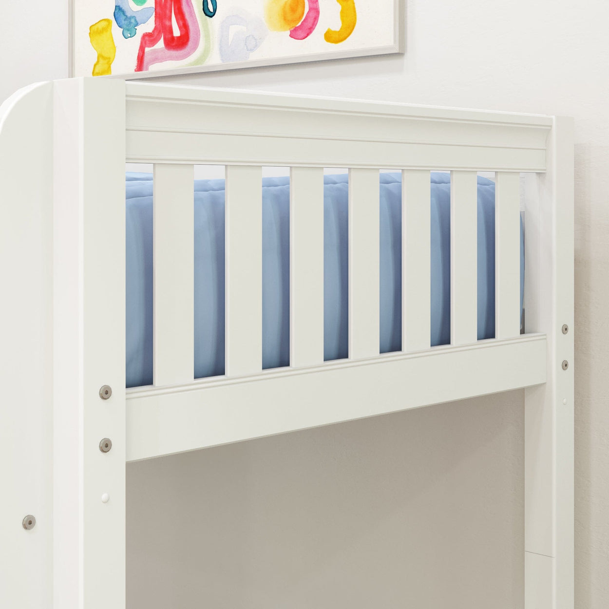 White wooden bunk bed with blue bedding and colorful artwork in a children's room.