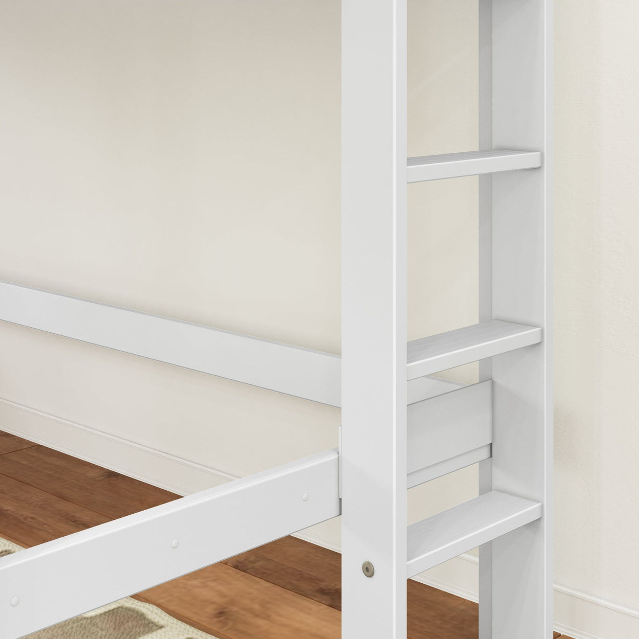 Close-up of white wooden bunk bed ladder and side rail on hardwood floor, modern children's loft bed frame with slatted steps and white finish