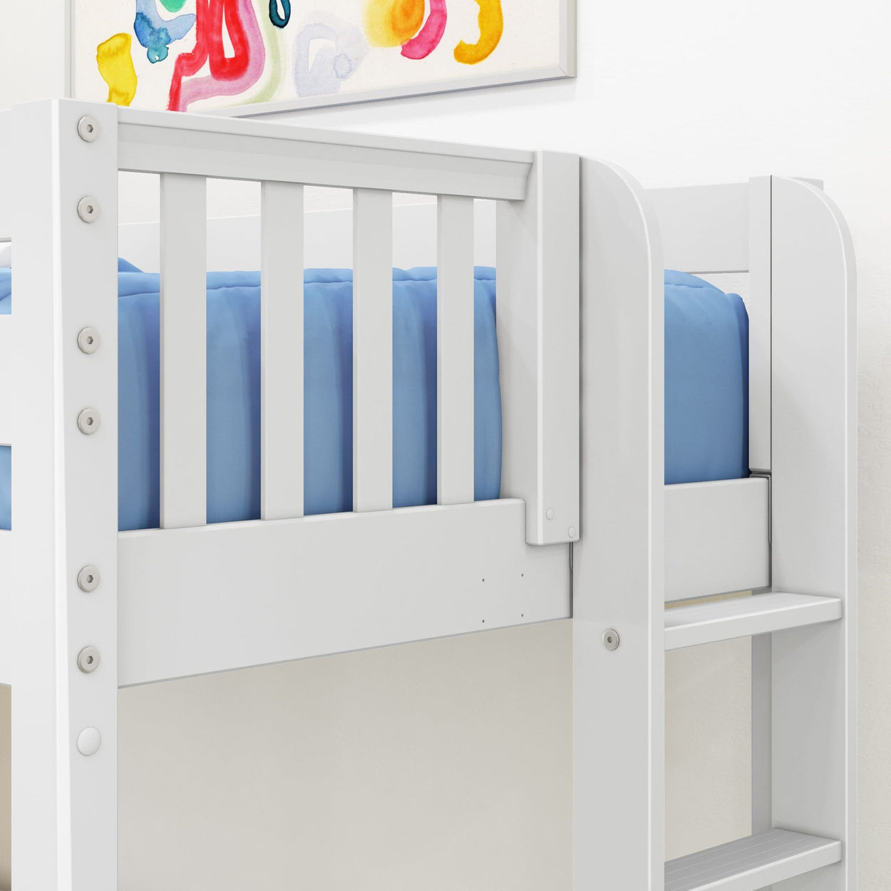 White wooden loft bunk bed with safety guardrail and ladder, blue mattress and colorful wall art in child's bedroom