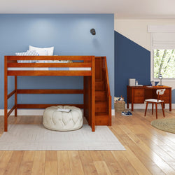 Loft bed with built-in stairs and study desk in a modern children's bedroom with blue accent wall.