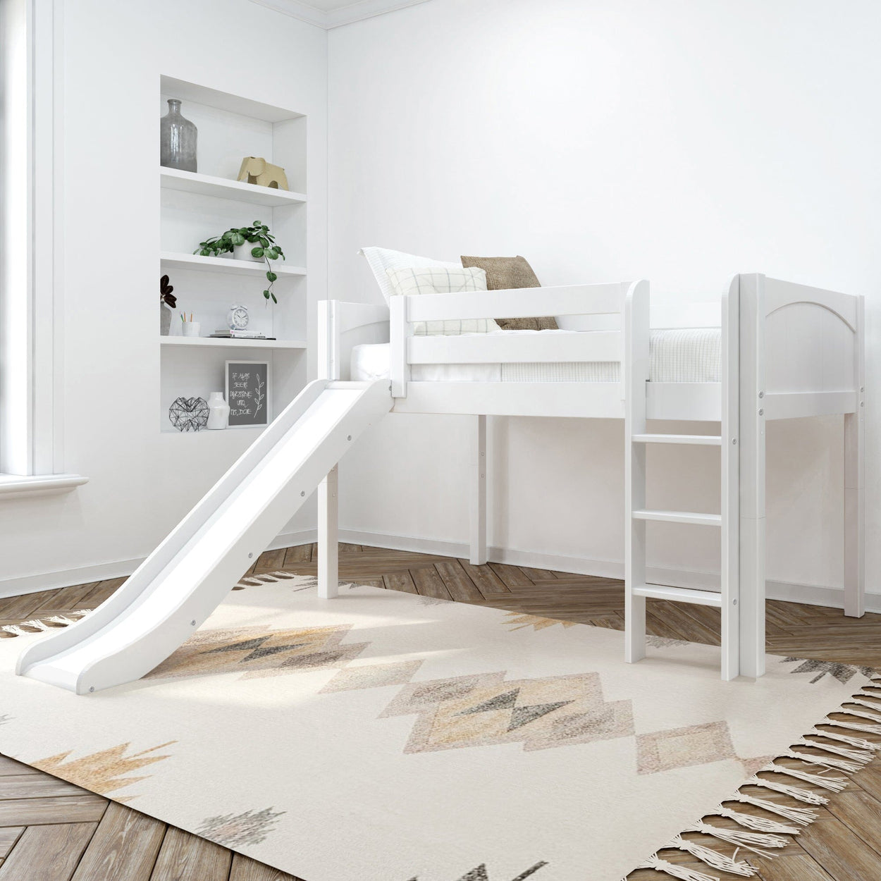 White loft bed with slide and ladder in modern children's bedroom with decorative shelves and geometric rug.