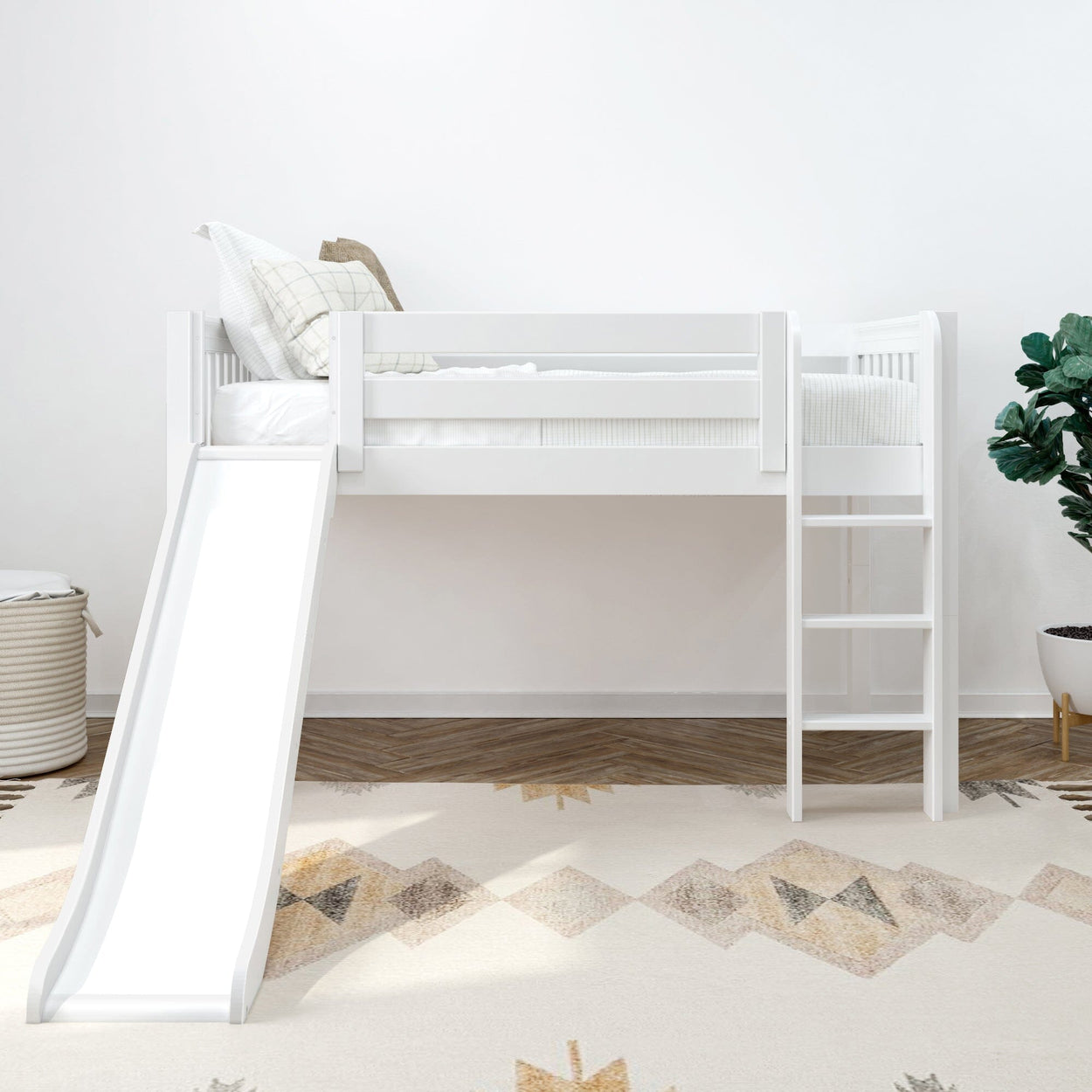 White loft bed with slide and ladder in children's room with geometric rug.