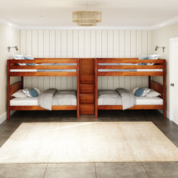 Four-bed wooden bunk bed set in a modern bedroom with white walls.