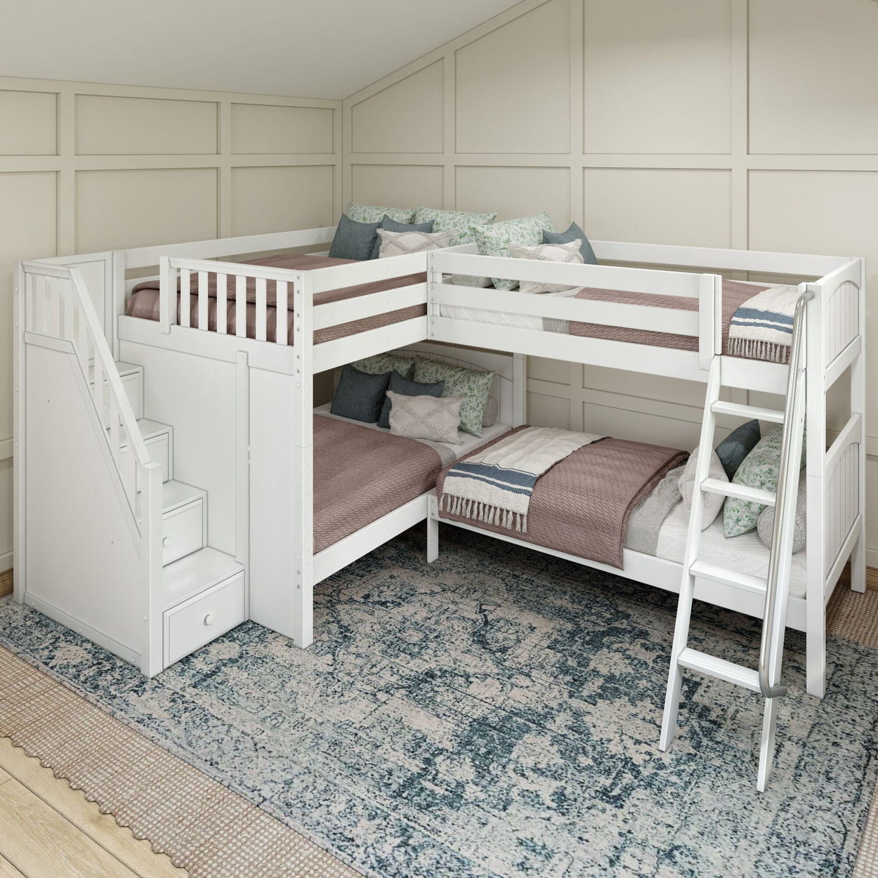 White L-shaped bunk bed with stairs and ladders, featuring cozy bedding in a modern children’s bedroom setting.