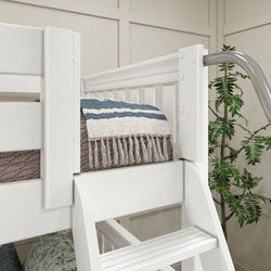 White bunk bed with ladder and decorative blanket in modern bedroom setup with plant.