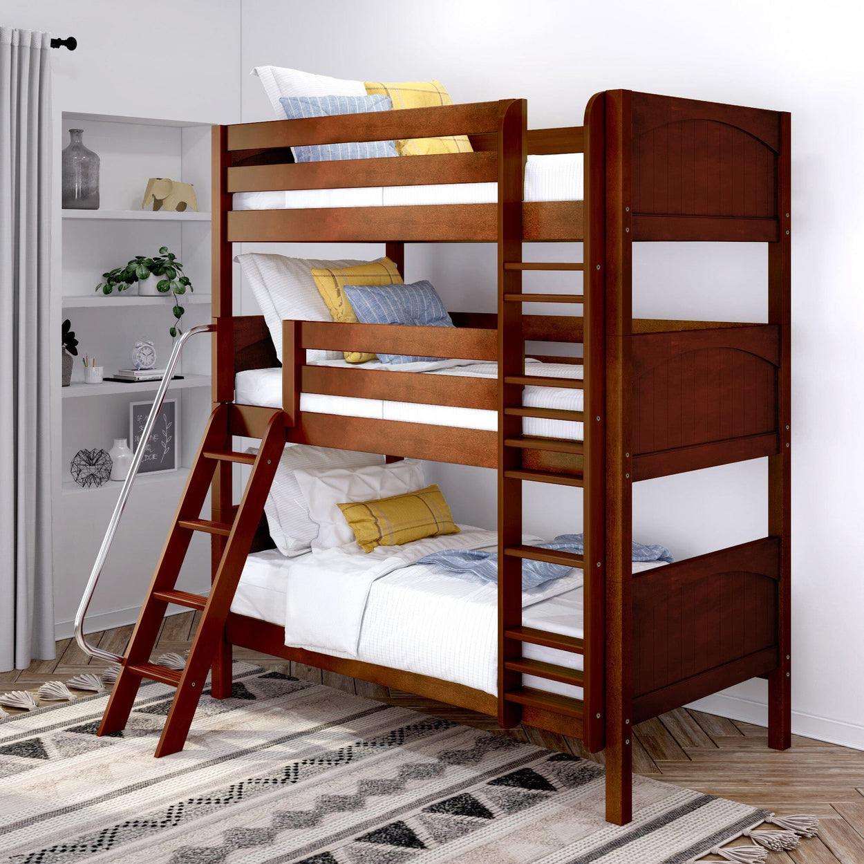 Dark wood triple bunk bed with white and yellow bedding in a modern bedroom with decorative shelf.