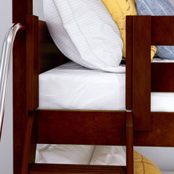 Wooden bunk bed with white and yellow pillows and a metal ladder in modern bedroom.