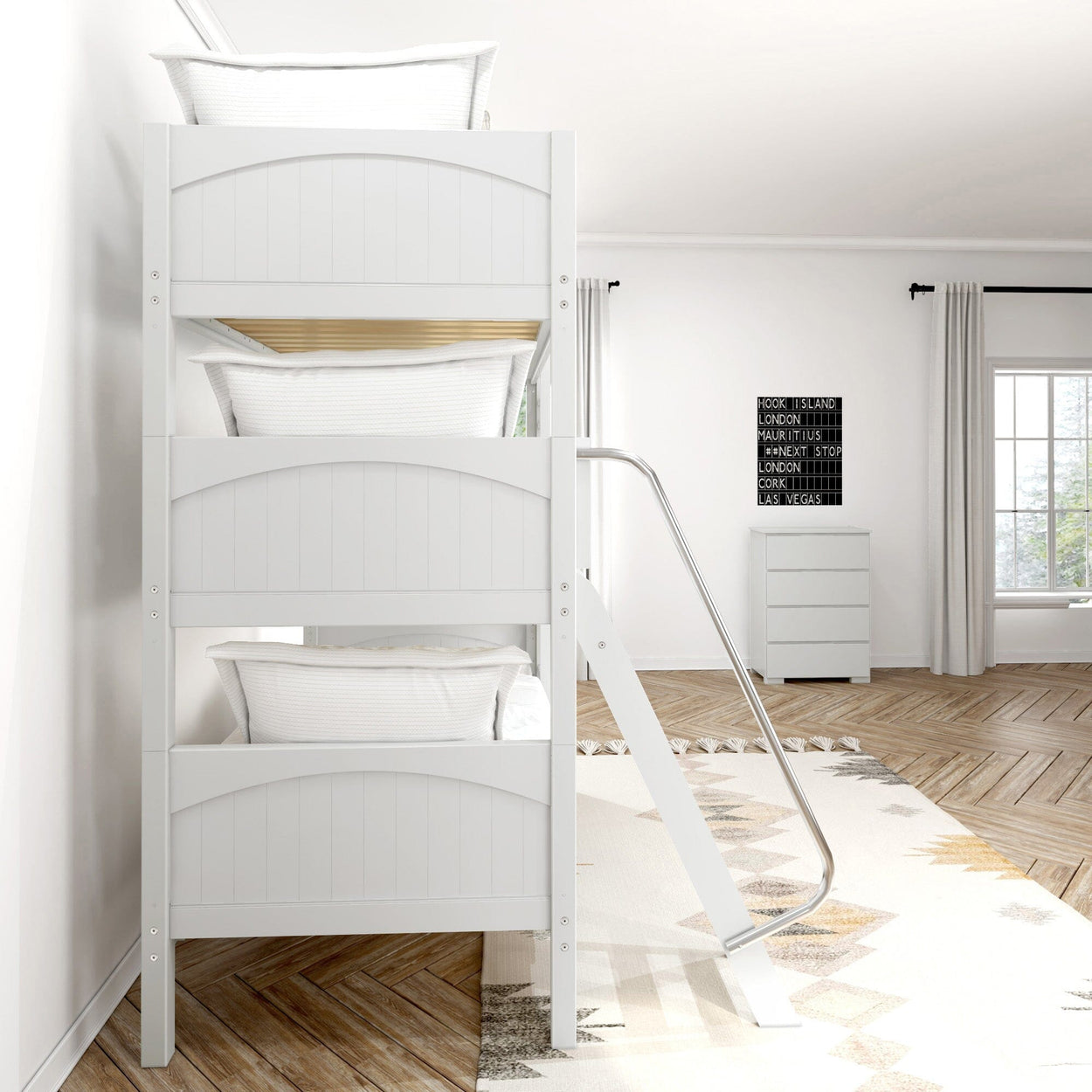 Triple bunk bed in modern bedroom with cozy white pillows and wooden flooring.