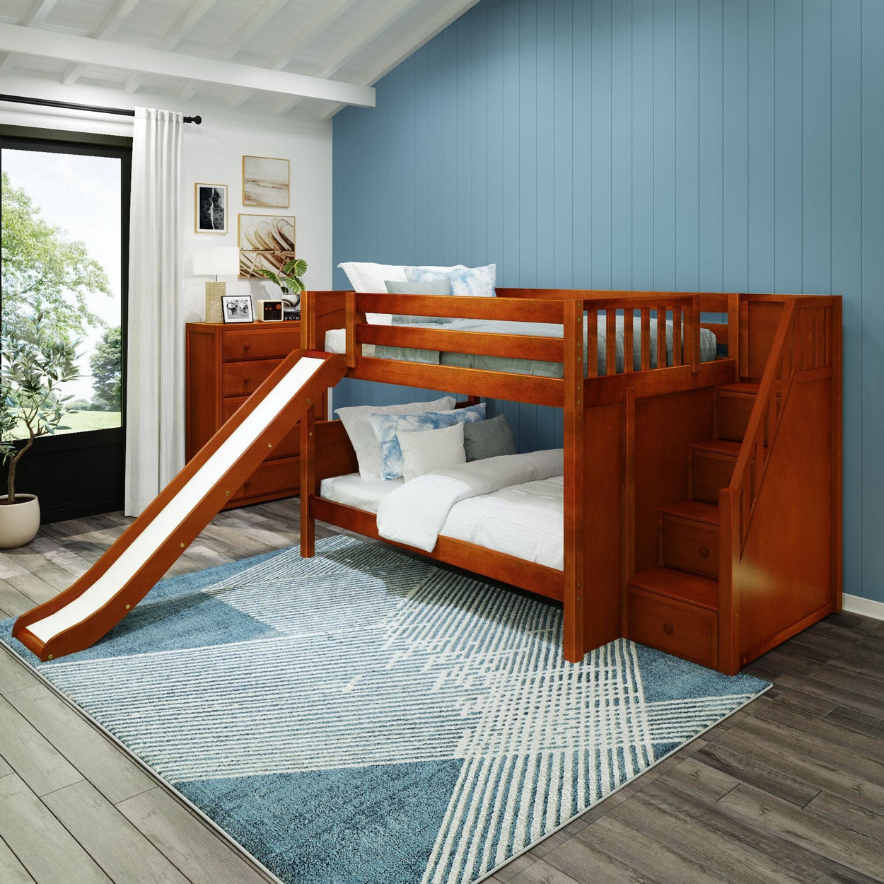 Children's wooden bunk bed with slide and stairs in a modern blue-themed bedroom.