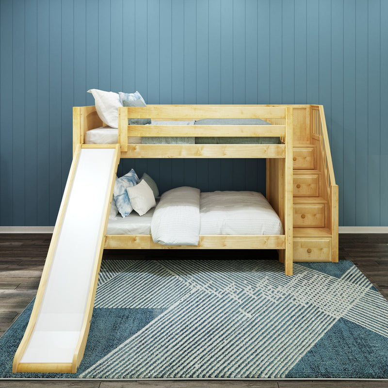 Natural wood kids bunk bed with slide and built-in storage stairs against blue paneled wall, white and blue bedding and geometric area rug