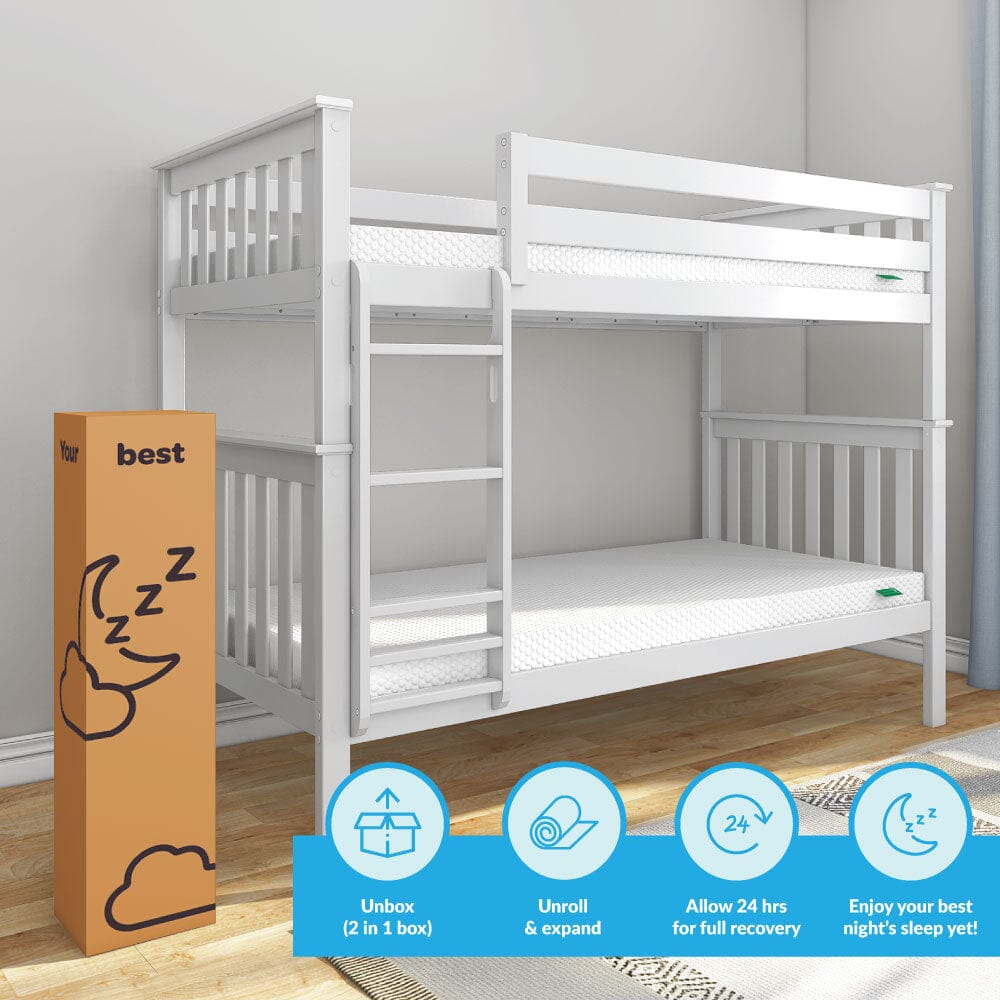 White wooden twin bunk bed with mattress next to packaging box in room with hardwood floor.