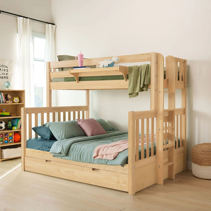 Natural wood twin-over-full bunk bed with ladder and under-bed storage in a bright kids' bedroom, styled with green bedding, plush toy and toy-filled shelf