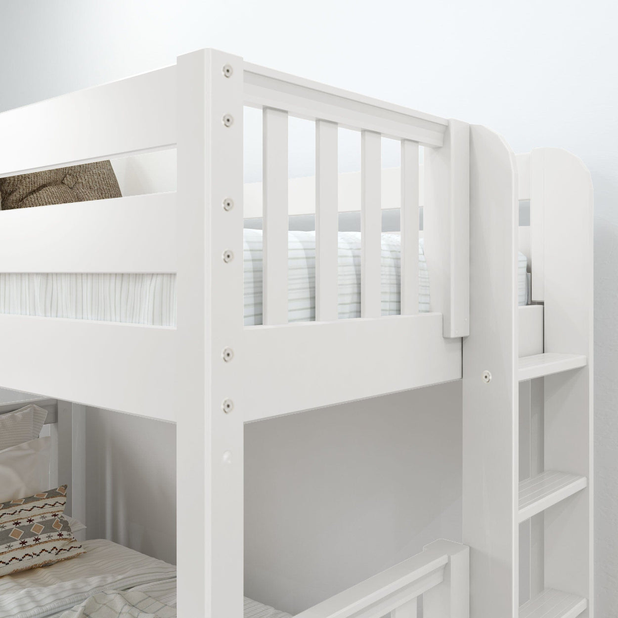 White wooden twin-over-twin bunk bed with built-in ladder, guardrails and striped bedding in a modern kids' bedroom