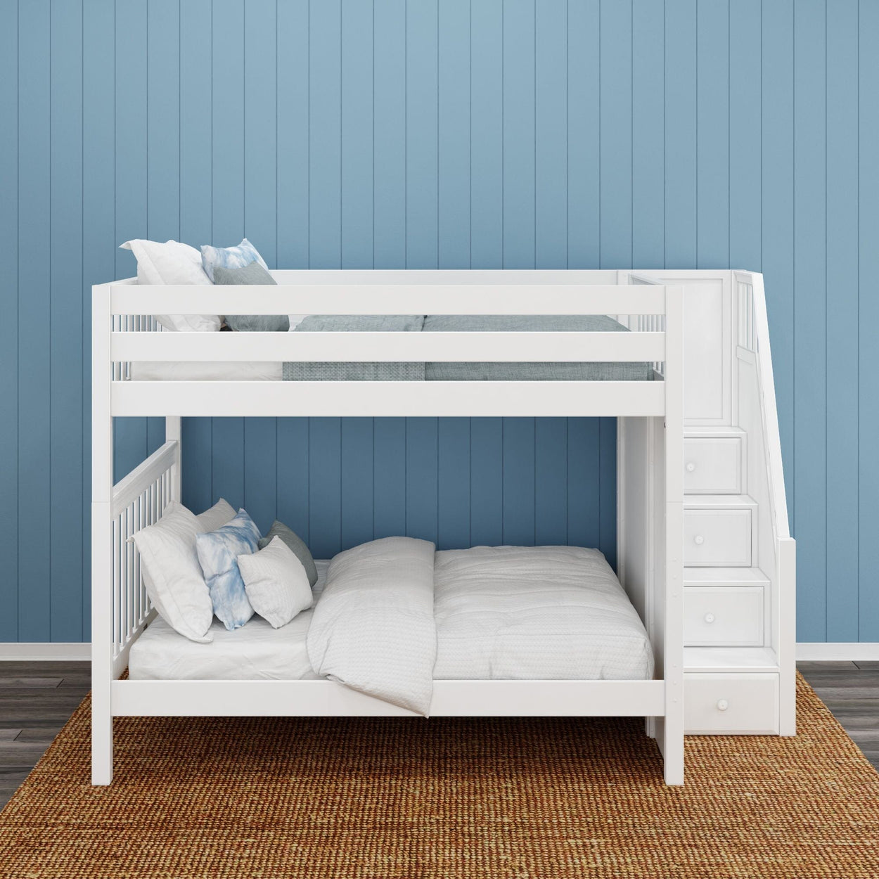 White wooden bunk bed with stairs and storage against blue vertical panel wall.