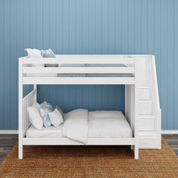 White wooden bunk bed with stairs and storage against blue vertical panel wall.